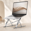 LOFTE Rise adjustable aluminum laptop stand supporting a laptop